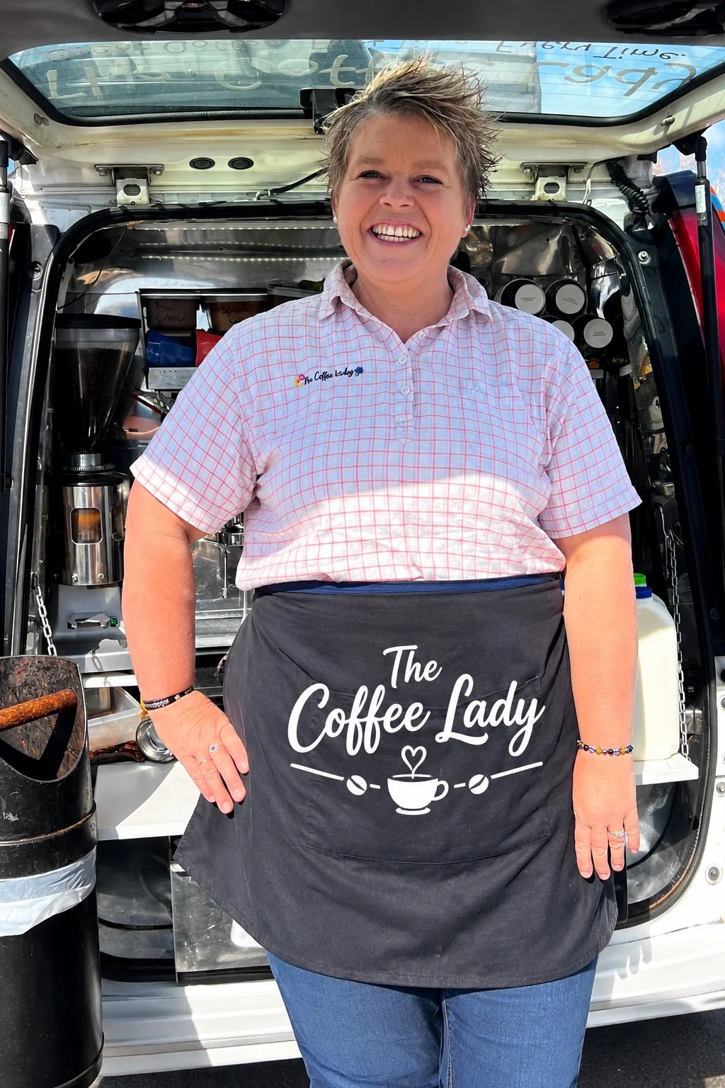 The Coffee Lady smiling at her mobile coffee van
